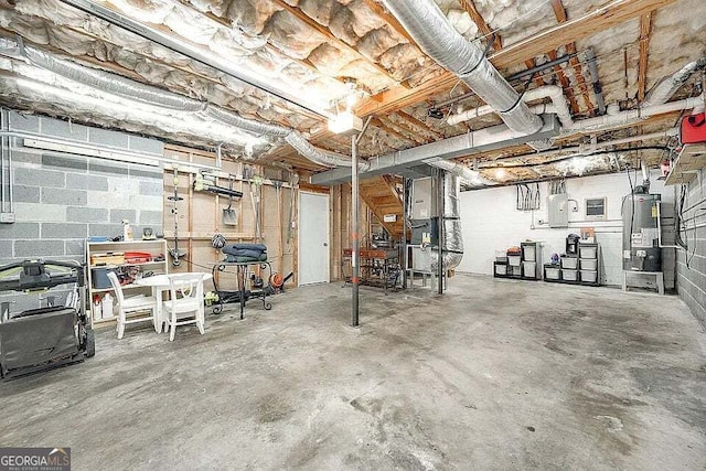 basement with electric panel and water heater