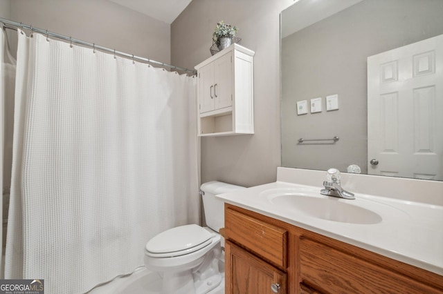 bathroom with vanity and toilet