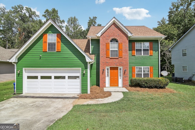 view of front of house with a garage and a front lawn