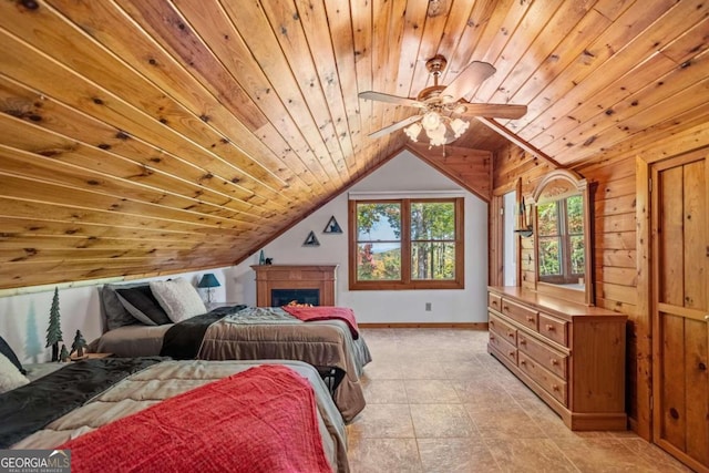 tiled bedroom featuring lofted ceiling, wooden walls, ceiling fan, and wooden ceiling