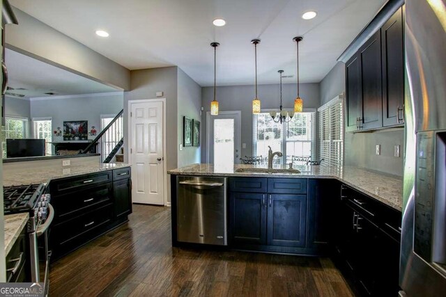 kitchen featuring kitchen peninsula, dark wood-type flooring, stainless steel refrigerator with ice dispenser, and ornamental molding