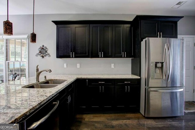 kitchen featuring appliances with stainless steel finishes, dark hardwood / wood-style flooring, a healthy amount of sunlight, and sink