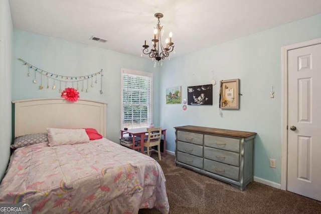 bedroom featuring an inviting chandelier and dark carpet