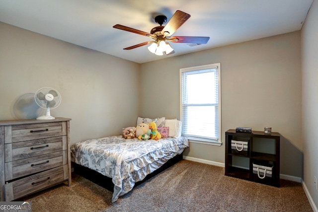 bedroom with ceiling fan and carpet floors