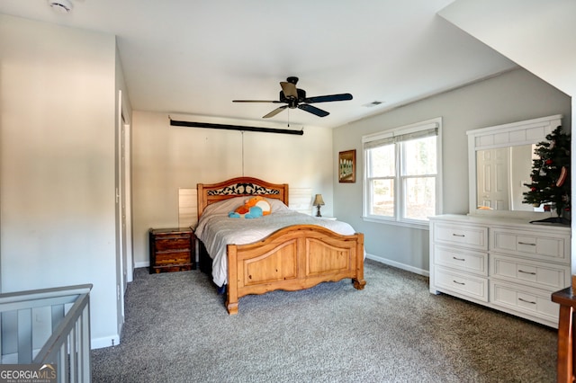 bedroom featuring dark colored carpet and ceiling fan