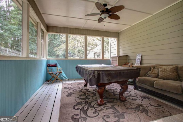 sunroom / solarium featuring ceiling fan and pool table