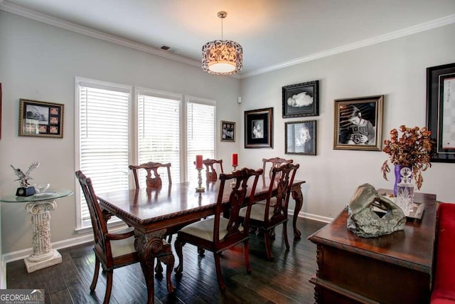 dining space featuring crown molding and dark hardwood / wood-style flooring