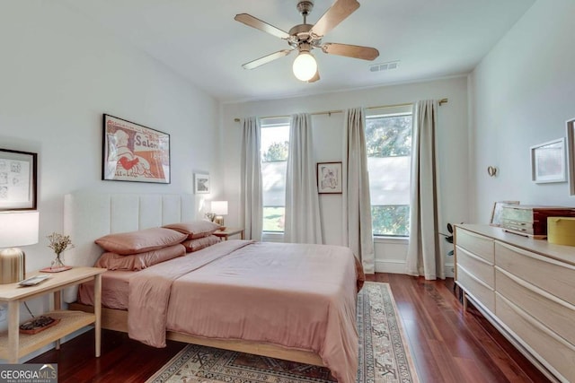 bedroom featuring dark hardwood / wood-style floors and ceiling fan