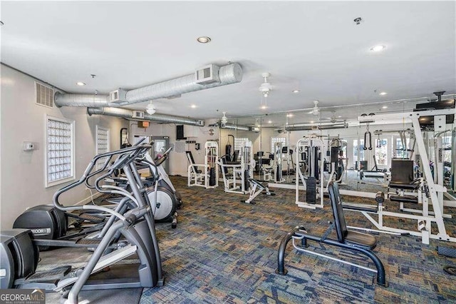 exercise room featuring carpet flooring