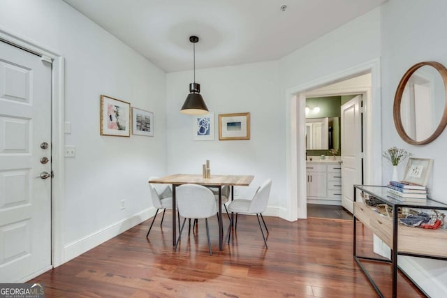 dining space featuring dark hardwood / wood-style flooring