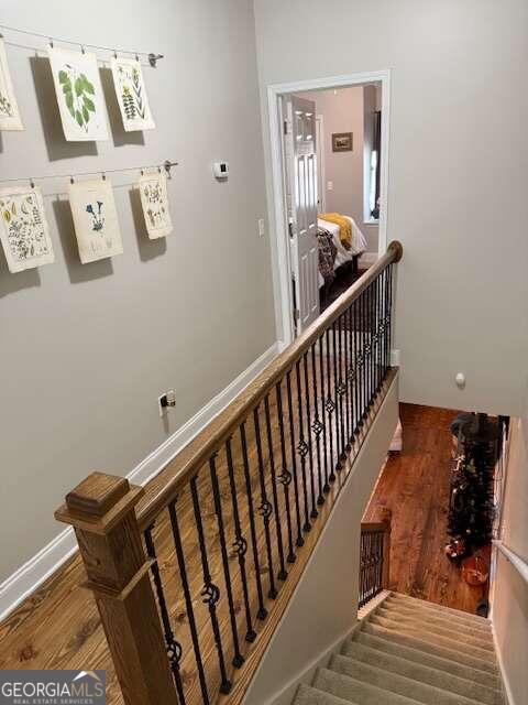 staircase featuring hardwood / wood-style floors