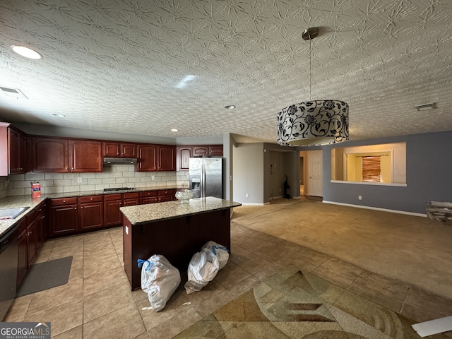 kitchen with decorative backsplash, light carpet, a textured ceiling, stainless steel fridge with ice dispenser, and a kitchen island