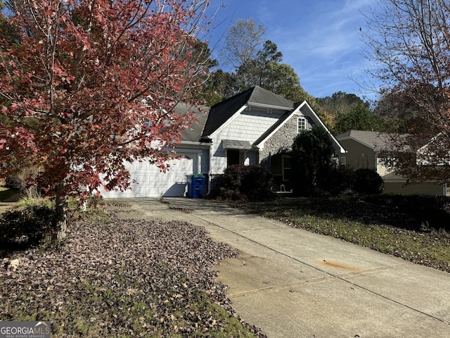 view of side of property featuring a garage