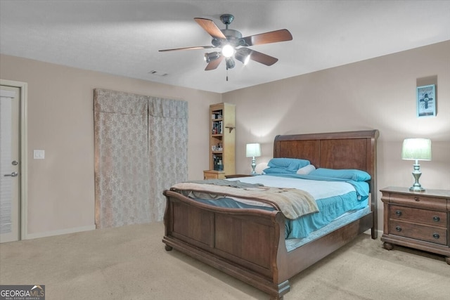 carpeted bedroom with ceiling fan