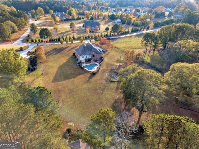 birds eye view of property featuring a rural view