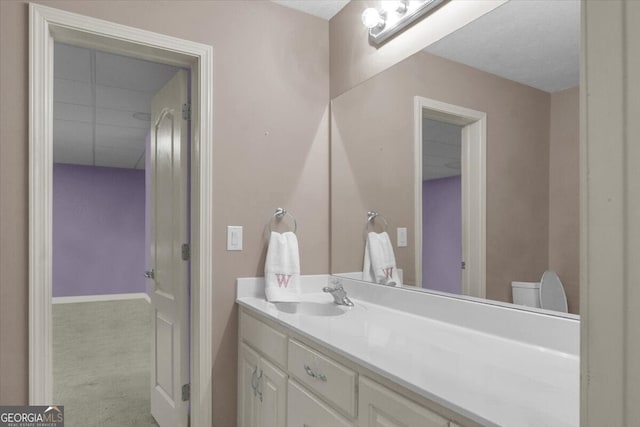 bathroom with vanity and toilet