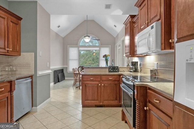 kitchen with ceiling fan, light stone countertops, tasteful backsplash, light tile patterned floors, and appliances with stainless steel finishes