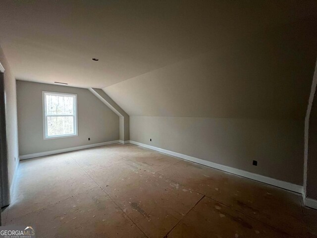 interior space featuring vaulted ceiling