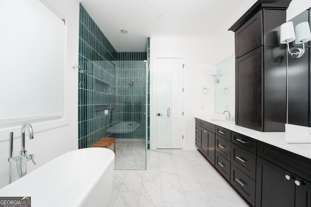 bathroom featuring ornamental molding, vanity, and independent shower and bath