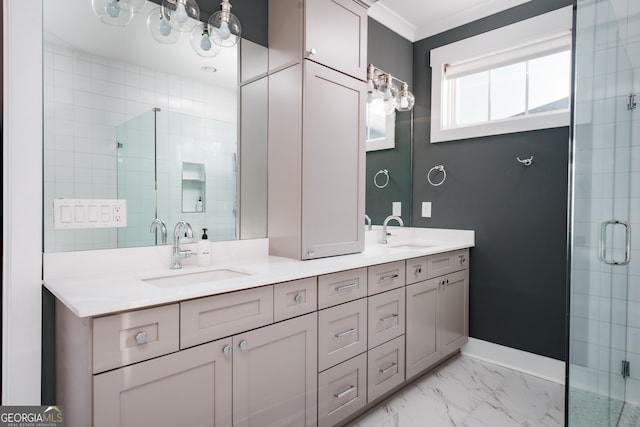 bathroom featuring vanity, a shower with door, and crown molding