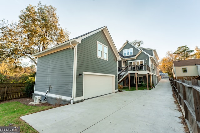 view of front of property featuring a garage and a deck