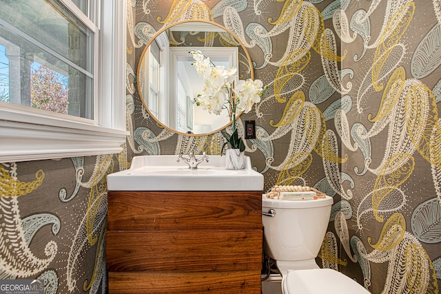 bathroom with vanity and toilet