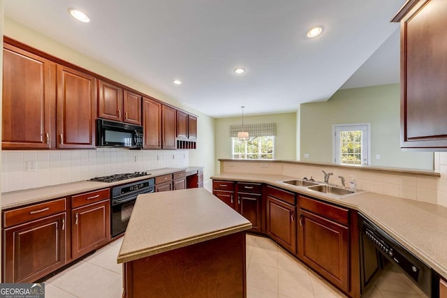 kitchen with sink, backsplash, a center island, black appliances, and decorative light fixtures