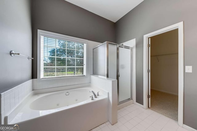 bathroom with independent shower and bath and tile patterned floors