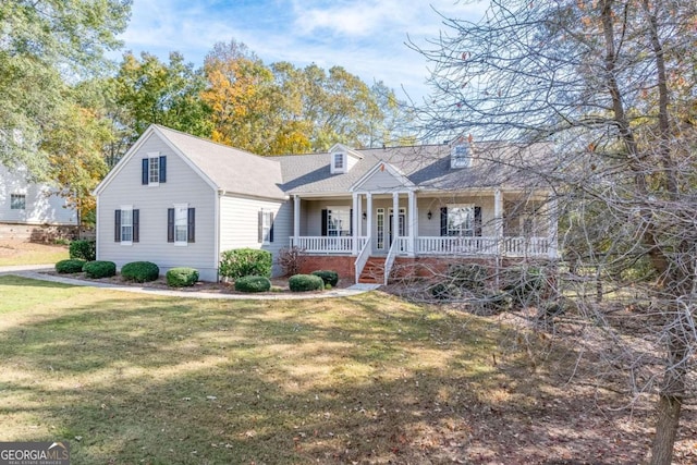 view of front of home with a porch and a front lawn