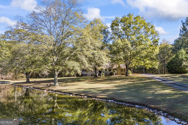 exterior space with a water view