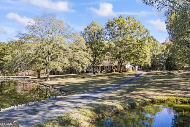 surrounding community with a water view