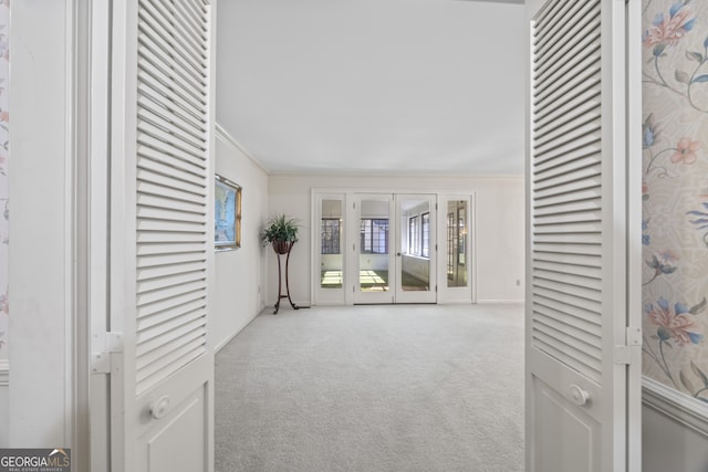 sitting room featuring carpet and ornamental molding