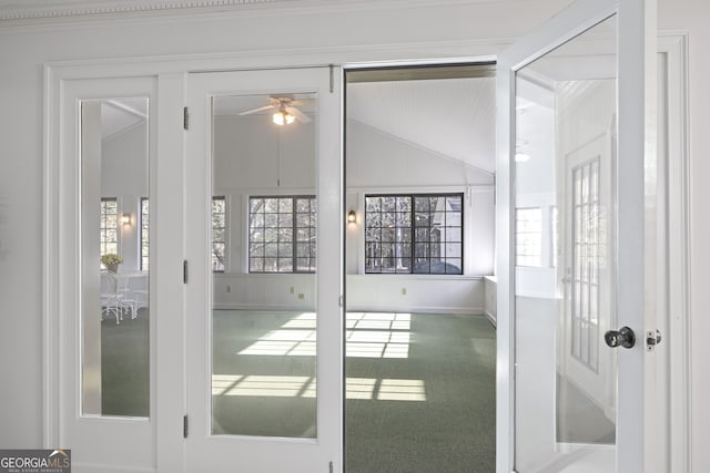 interior space featuring ceiling fan and lofted ceiling