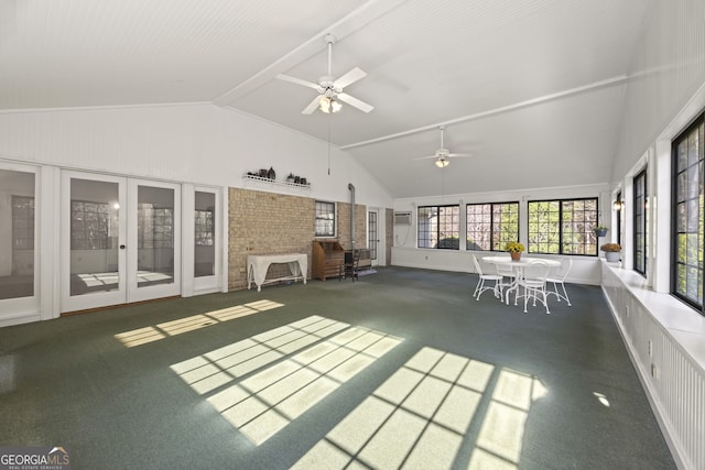 unfurnished sunroom with ceiling fan and vaulted ceiling