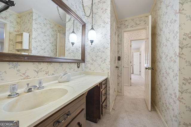 bathroom with crown molding and vanity