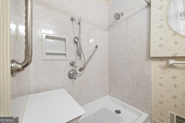 bathroom with a tile shower