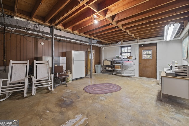 basement featuring white refrigerator