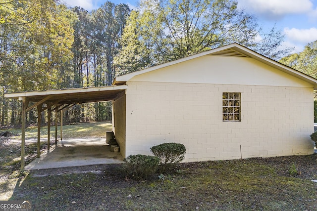 view of side of property featuring a carport