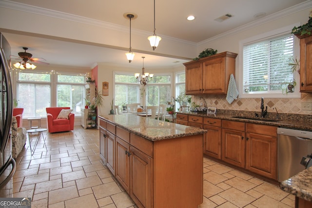 kitchen with dishwasher, a center island, backsplash, sink, and dark stone countertops