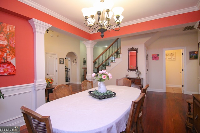 dining room featuring a notable chandelier, wood-type flooring, and crown molding