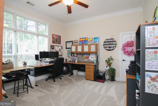 office featuring ceiling fan, crown molding, and light carpet