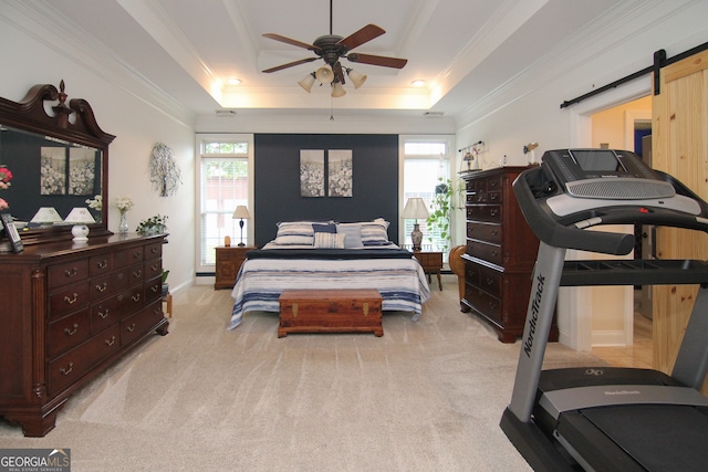 bedroom with light carpet, a raised ceiling, multiple windows, and ceiling fan