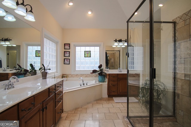 bathroom featuring tile patterned floors, vanity, plus walk in shower, and vaulted ceiling