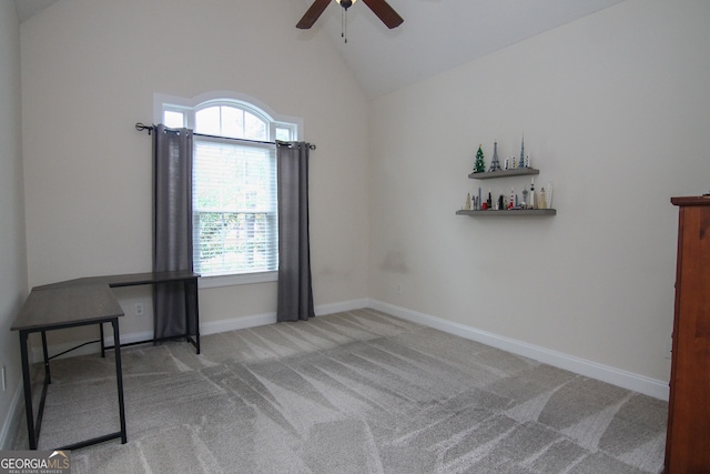 empty room with light colored carpet, high vaulted ceiling, and ceiling fan