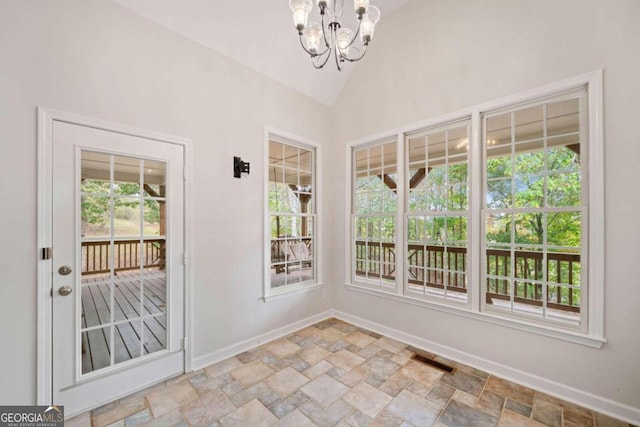 interior space featuring a chandelier and vaulted ceiling