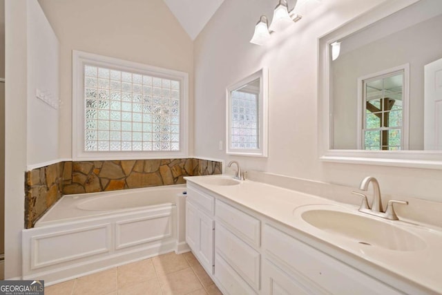 bathroom with a bath, vanity, tile patterned floors, and lofted ceiling