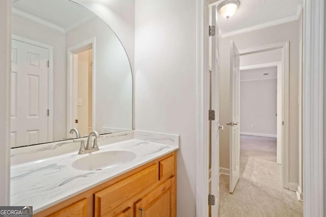 bathroom with tile patterned floors, vanity, and ornamental molding