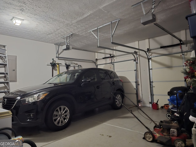 garage with electric panel and a garage door opener