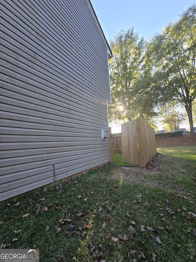 view of home's exterior featuring a yard