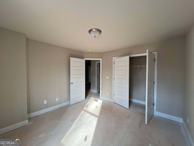 unfurnished bedroom with a closet